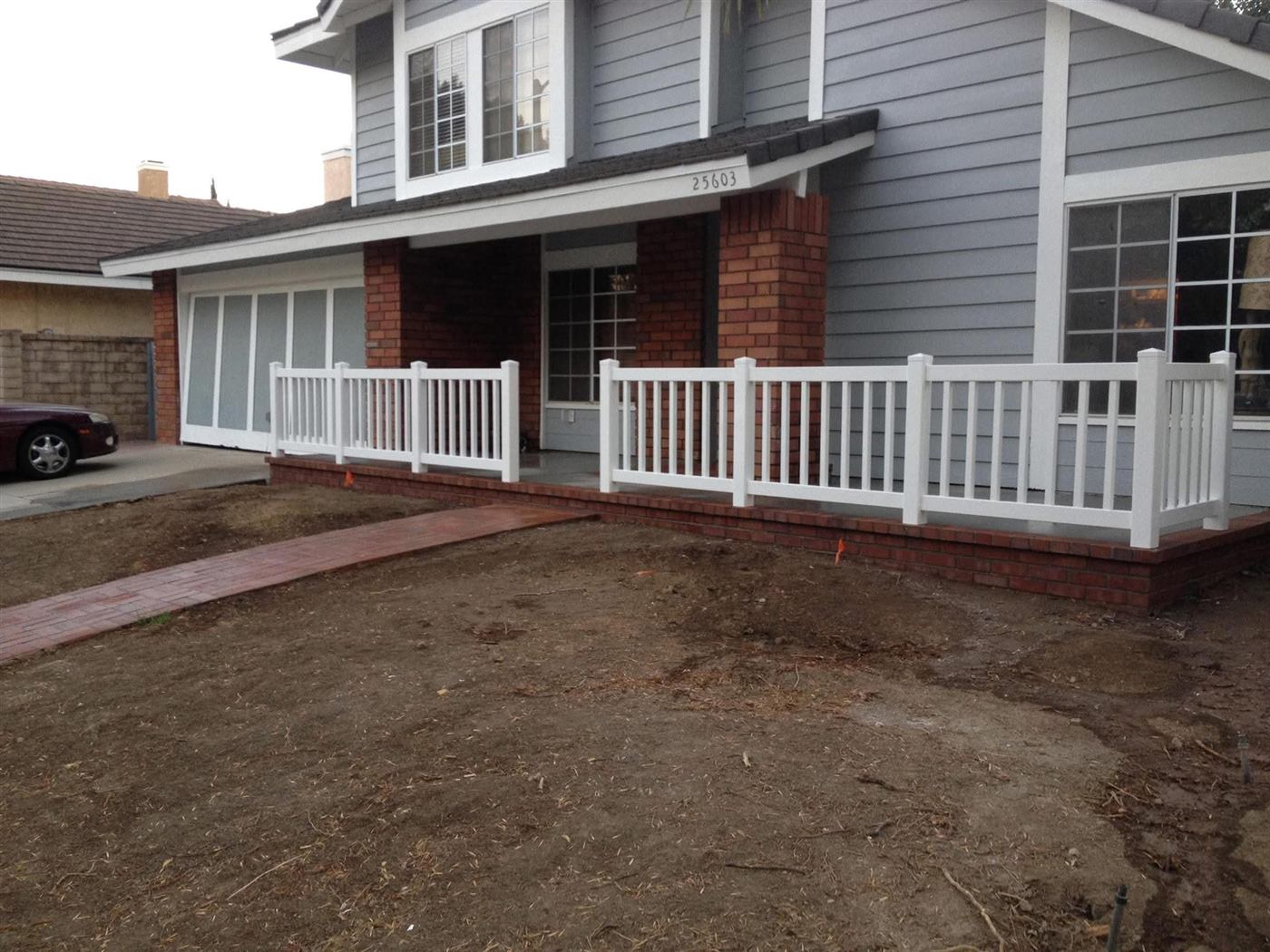 White vinyl porch railing on a two-story home