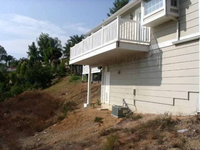 White vinyl railing on a home's rear balcony